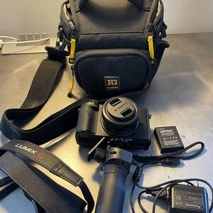 Panasonic Lumix G100D Mirrorless Camera w 12-32mm lens, tripod+batteries+bag
